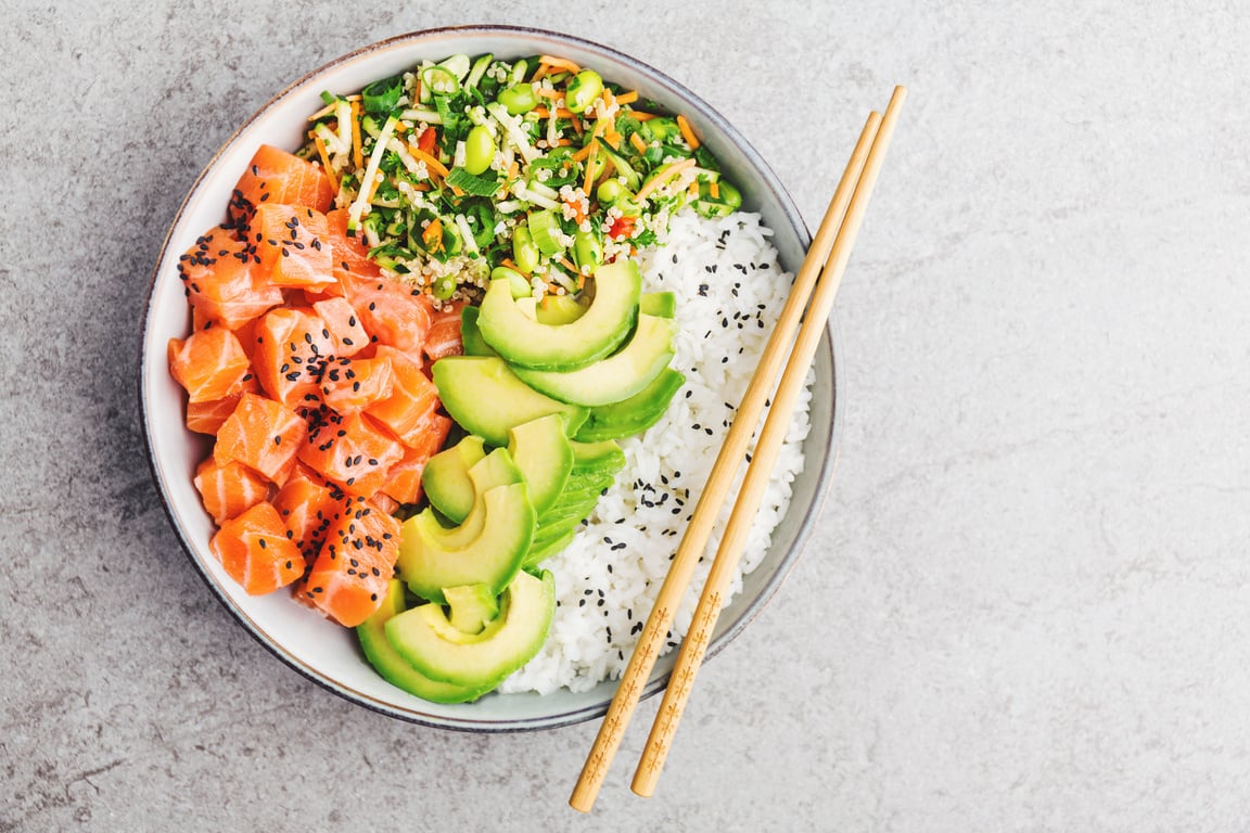 Poke bowl with salmon served in bowl